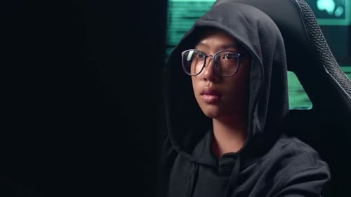 Asian Boy Hacker Using Computer Hacking