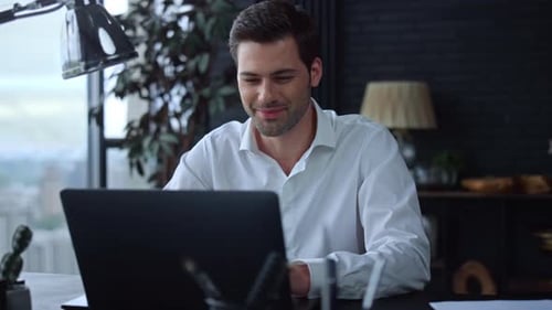 Businessman Working on Laptop at Home Office. Professional Typing on Keyboard