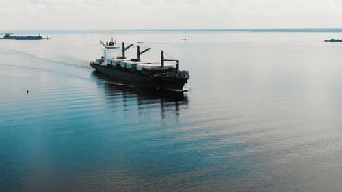Huge Cargo Ship with Cranes Containers Sails on Blue River