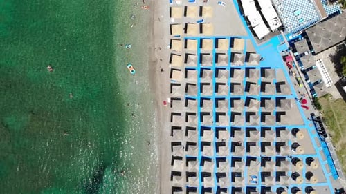 Scenic Beach with Umbrellas and Clear Turquoise Water