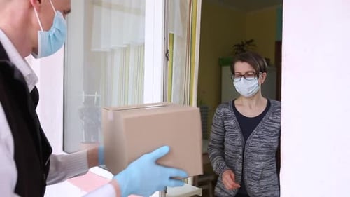 Package Delivery During Pandemic With Face Mask