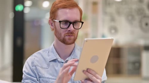 Man with Tablet Working in Modern Office