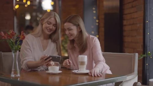 Sequence of Happy Women Laughing and Taking Photo of Cappuccino in Cafe