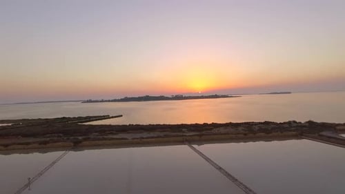 Aerial view of a lake at sunset.