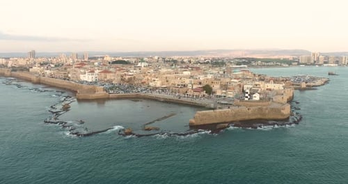 Aerial view of natural water pool along the coast in Acre Old town, Israel.