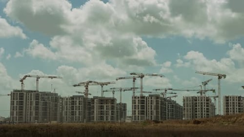 City Buildings Under Construction with Tower Cranes