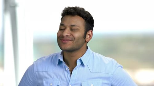 Man Smiling and Looking Upbeat