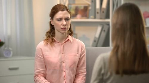 Woman Demonstrates Sign Language to Another Woman