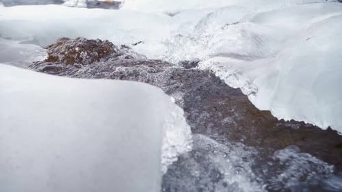 Course of a Stormy Mountain River in Winter