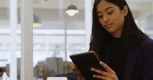 Businesswoman Using Digital Tablet in Office 4k