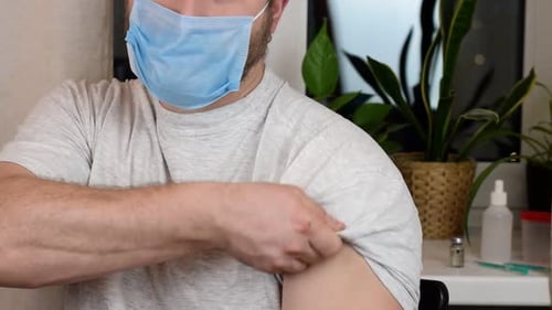 Adult Rolling Up Sleeve Wearing Mask
