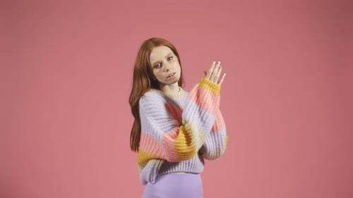 Woman Posing with Red Hair and Sweater