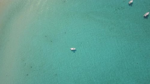 Aerial drone view of a fishing motor boat in the Bahamas, Caribbean.
