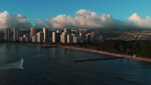 Aerial drone footage of Honolulu, Hawaii.
Beautiful real estate, buildings in the city.
Palm trees