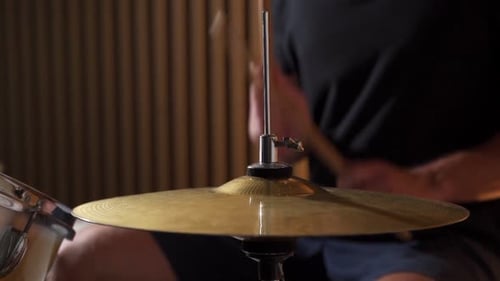 Drummer Playing Golden Cymbal Close Up in Studio