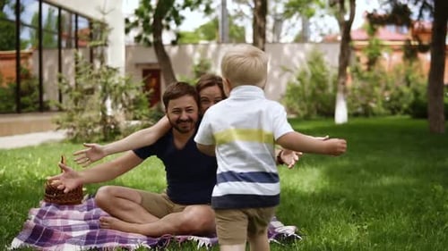 Loving Family Embrace in Sunny Backyard