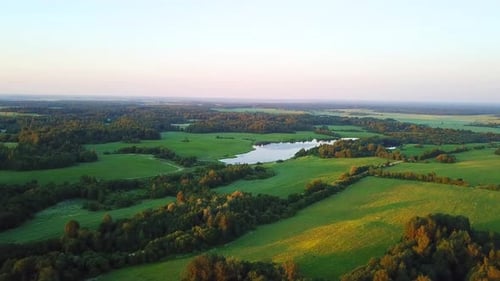 Picturesque Aerial View of Farmland with Lake