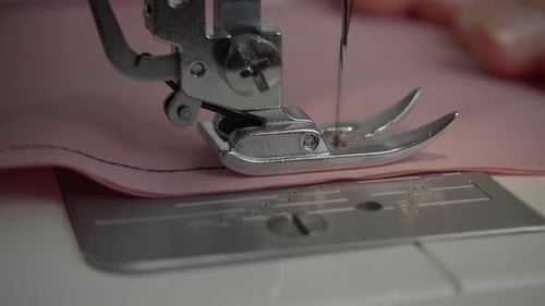 Sewing Machine Stitching Pink Fabric Close Up