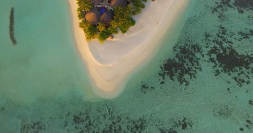 Aerial drone view of a scenic tropical island in the Maldives.