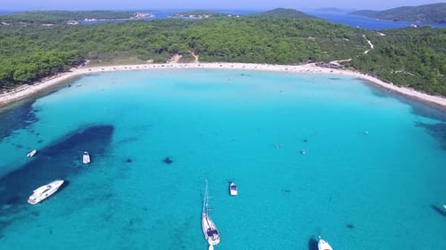 Aerial view of yachts in aquamarine lagoon