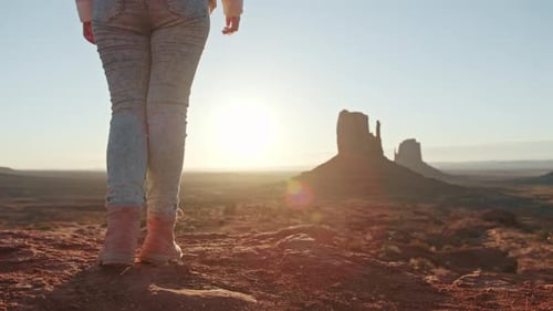 Nature Background Close Up of Traveler Woman in Monument Valley at Sunset USA