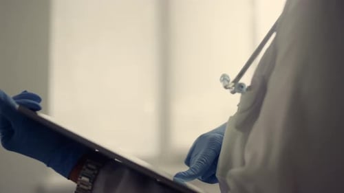 Woman Doctor Collecting Medical History Senior Patient Using Tablet Close Up