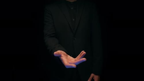 Man Extends Hand Out In The Dark