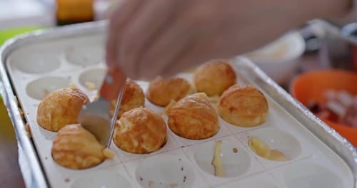 Cooking Delicious Golden Brown Japanese Takoyaki