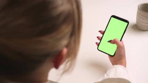 Close Up Woman Hands Holding Chromakey Green Screen Smartphone Watching Content Swiping Scrolling