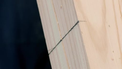Vertical Shot Worker Makes Mark on Beam with Pencil and Cuts Wood with Milling Machine
