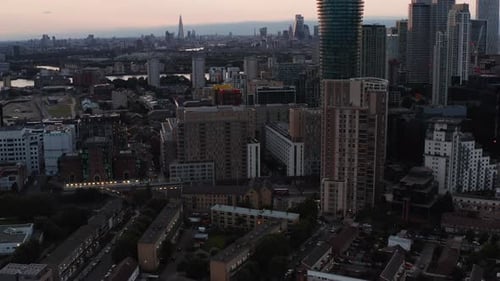 Aerial View of Urban Neighbourhood Tilt Up Reveal Tall Office and Apartment Buildings and City