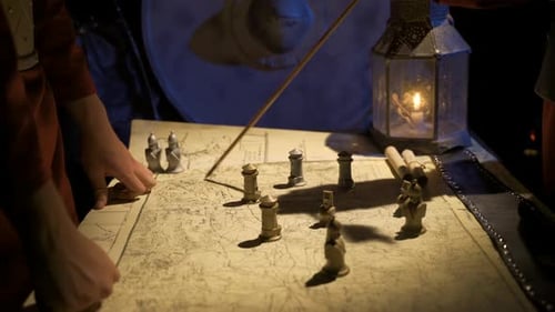 People Planning Military Strategy With Map and Figures