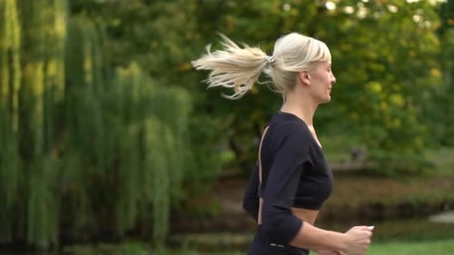 Woman Runner Running in the Park, Slow Motion