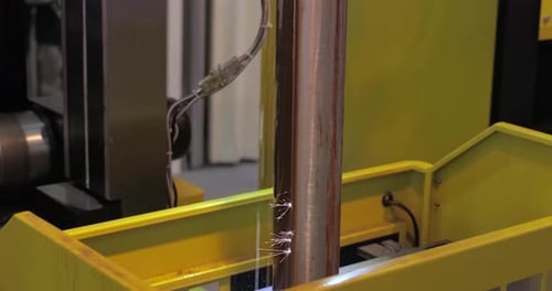 Automated Machinery Sparks on Metal Pole