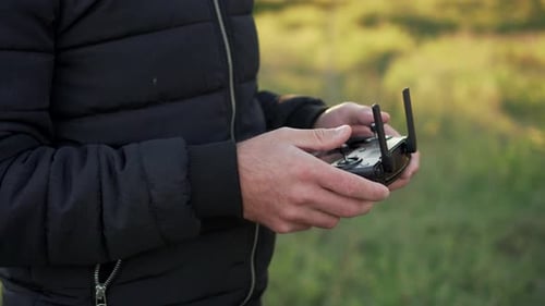 Man Controls Drony Console, Close-up