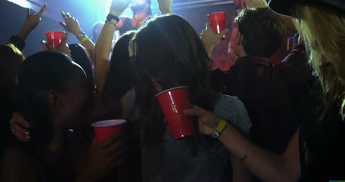 Diverse Group of Young Adults Dancing at Party