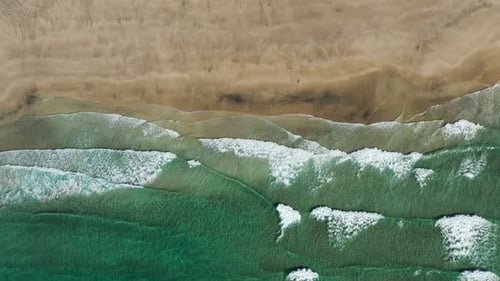 Top down view on the tropical sand Beach with Splashing Sea Waves,Norway