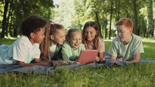 School Friends Using Tablet Outdoors