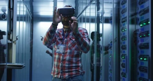 Man Using VR Glasses in Data Center