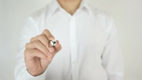 Hand Writes the Word Designer on Screen