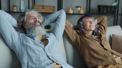 Couple Relaxing Together on Couch at Home