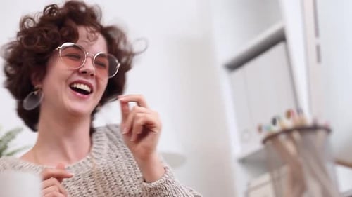 Young Woman Dances in her Home Office