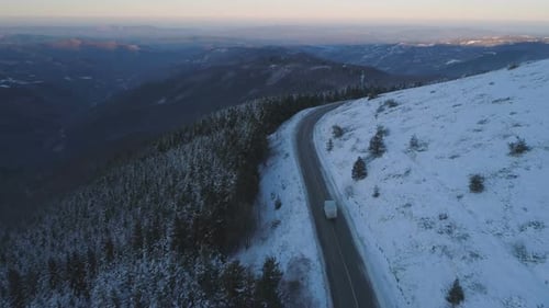 Truck Driving On Winter Ice Road, Aerial View Drone Following