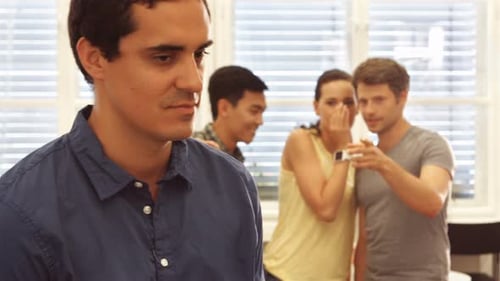 Business executive making fun of colleague
