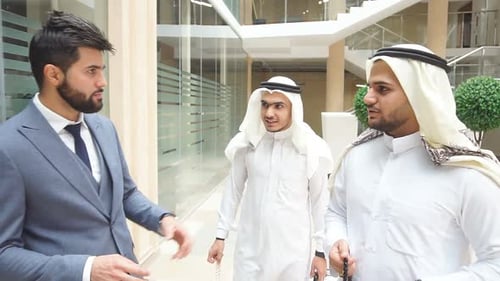 Caucasian Man Leads Sheikhs To Discuss Business Ideas.