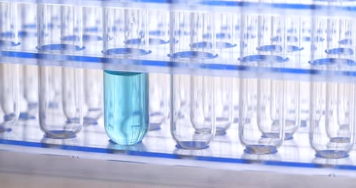 Test Tubes with Blue Liquid in Laboratory Setting