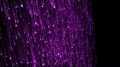 Abstract Purple Glowing Particles Falling Background