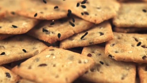 Multigrain Crackers with Seeds Falling in Close Up