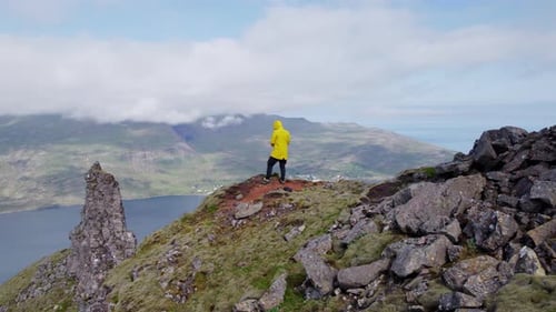 Drone Flight Of Man Standing On Mountain Peak