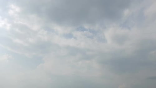 Time lapse of white cloud moving pass around sky background